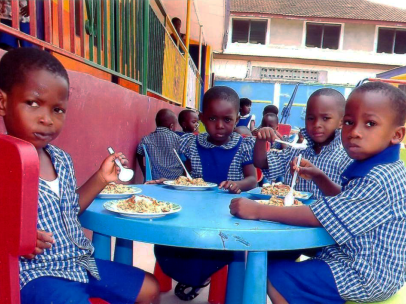 Ghana-West-Africa-children-kids-eating-at-blue-table